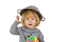 Portrait of funny little blonde girl with colander on her head