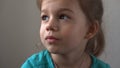 Portrait Funny little close up view happy preschool girl smiling child looking away thoughtfully, pretty natural face Royalty Free Stock Photo