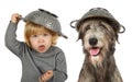 Portrait of a funny little girl with a colander on her head and Irish wolfhound dog