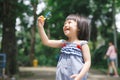 Portrait of funny lovely little girl blowing soap bubbles Royalty Free Stock Photo