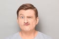 Portrait of funny man grimacing and making goofy crazy face Royalty Free Stock Photo