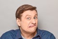 Portrait of funny man grimacing and making goofy crazy face Royalty Free Stock Photo