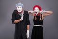 Portrait of funny mime couple with white faces and Royalty Free Stock Photo