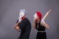 Portrait of funny mime couple with white faces and