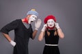 Portrait of funny mime couple with white faces and Royalty Free Stock Photo