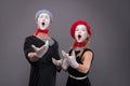 Portrait of funny mime couple with white faces and Royalty Free Stock Photo