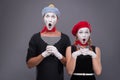 Portrait of funny mime couple with white faces and Royalty Free Stock Photo