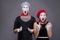 Portrait of funny mime couple with white faces and Royalty Free Stock Photo