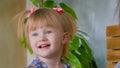 Portrait of funny shy little girl at home Royalty Free Stock Photo