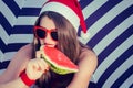 Portrait of a funny smiling girl in Santa Claus hat Royalty Free Stock Photo