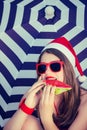 Portrait of a funny smiling girl in Santa Claus hat Royalty Free Stock Photo