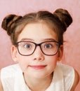 Portrait of funny smiling little girl child wearing glasses isolated