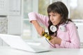 Portrait of funny teen girl playing computer game on modern laptop Royalty Free Stock Photo