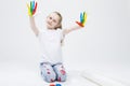 Portrait of Funny Young Girl Showing Messy Colorful Hands Brightly Painted During Paint Craft