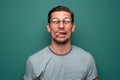 Portrait of a funny young man in glasses