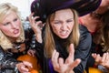 Portrait of a funny young woman wearing witch costume during Halloween Royalty Free Stock Photo