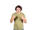 Portrait of furious young man, long curly hair style, keeps fists clenched, looking strained, isolated on white background. Angry Royalty Free Stock Photo