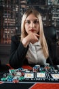 Portrait of gambling lucky woman playing poker with card and chips at casino Royalty Free Stock Photo