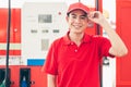 Portrait Gas station service staff Asian male worker happy smiling working car gasoline refill service job Royalty Free Stock Photo