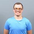 Portrait of a geek looking guy with huge glasses