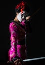 Portrait of geisha holding sword