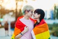 Portrait of a gender fluid couple wearing rainbow flag Royalty Free Stock Photo