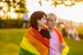 Portrait of a gender fluid couple wearing rainbow flag Royalty Free Stock Photo