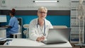 Portrait of general practitioner using laptop at health care checkup Royalty Free Stock Photo