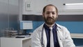 Portrait of general practitioner working on laptop in medical office Royalty Free Stock Photo