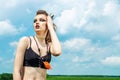 Portrait of a girl with aggressive make-up war paint indian amazon posing against the sky on nature Royalty Free Stock Photo