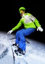 Portrait of girl balancing on snowboard at night Royalty Free Stock Photo