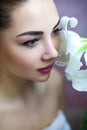 Portrait Of Girl With Big Eyes And Amaryllis