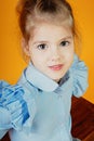 Portrait of  girl with big eyes,  blue shirt is put on her Royalty Free Stock Photo