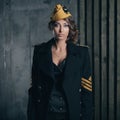 Portrait of girl in a black aviator uniform with hat Royalty Free Stock Photo