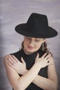 Portrait of a girl in a black hat