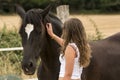 Young girl with her horse in a natural dressage exhibition in Lugo, Spain, june 2015