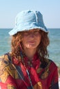 Portrait of girl in blue panama at seaside