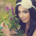 Portrait of Girl Boho with bouquet of wildflowers.