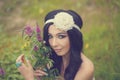 Portrait of Girl Boho with bouquet of wildflowers.