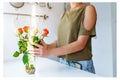 Portrait girl with bouquet of multi-colored roses at home