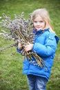 Portrait Girl with a branch of willow. Salix. Easter traditions.