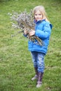 Portrait Girl with a branch of willow. Salix. Easter traditions.