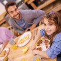 Portrait, girl and breakfast in kitchen in home with family, eating and bonding together at table. Food, pancakes and Royalty Free Stock Photo