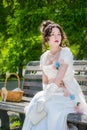 Portrait of girl in bride dress with a book in their hands Royalty Free Stock Photo
