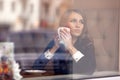 Portrait of a girl in the cafe for a glas