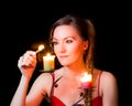 Portrait of a girl candle lights a match Royalty Free Stock Photo