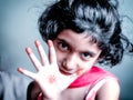 Portrait of girl child showing palm