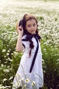 Portrait girl child in a white dress standing Royalty Free Stock Photo