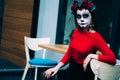 Portrait of a girl in the city with a make-up, make-up for halloween, day of the dead, zombies. dead among us, ghost. walk of skel