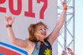 A portrait of a girl dancing a Brazilian samba dance on the embankment of the Volga River